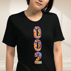 Close-up of PeaMac Pickleball Tees unisex pickleball T-shirt with a vibrant psychedelic tri-blend design.