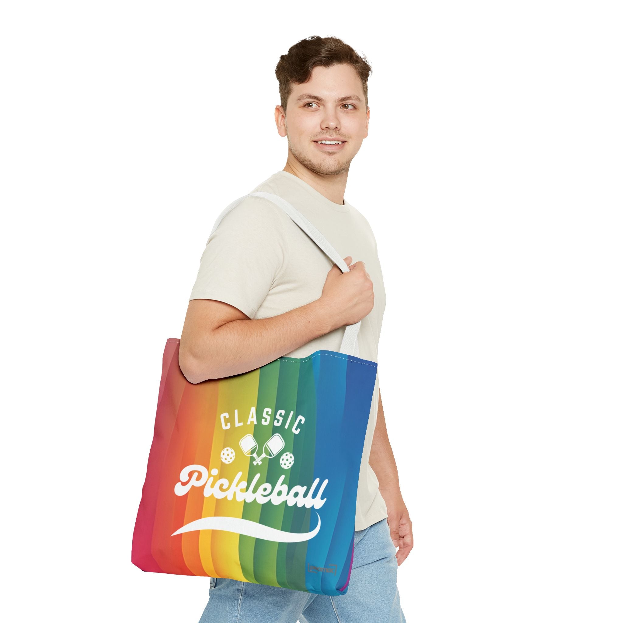 Pickleball Classic Rainbow Tote Bag with crossed paddles script design, featuring vibrant rainbow colors and durable fabric.