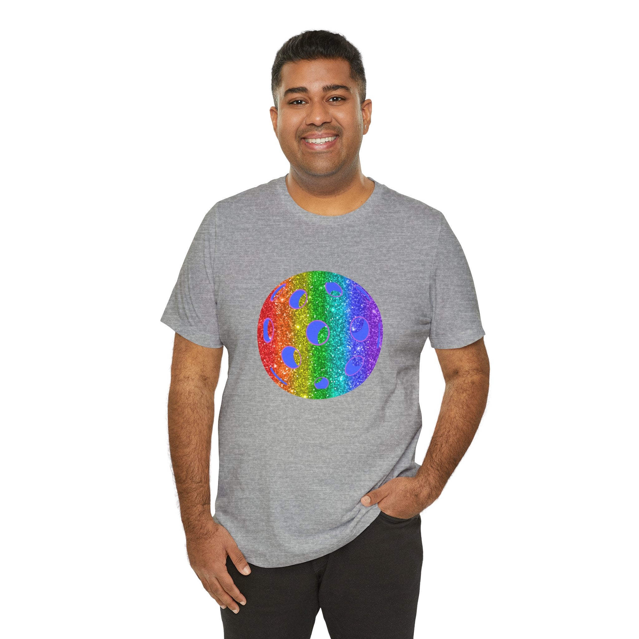 Rainbow glitter pickleball pride T-shirt with "Sparkle Loud and Proud" slogan, featuring vibrant rainbow colors and sporty design.