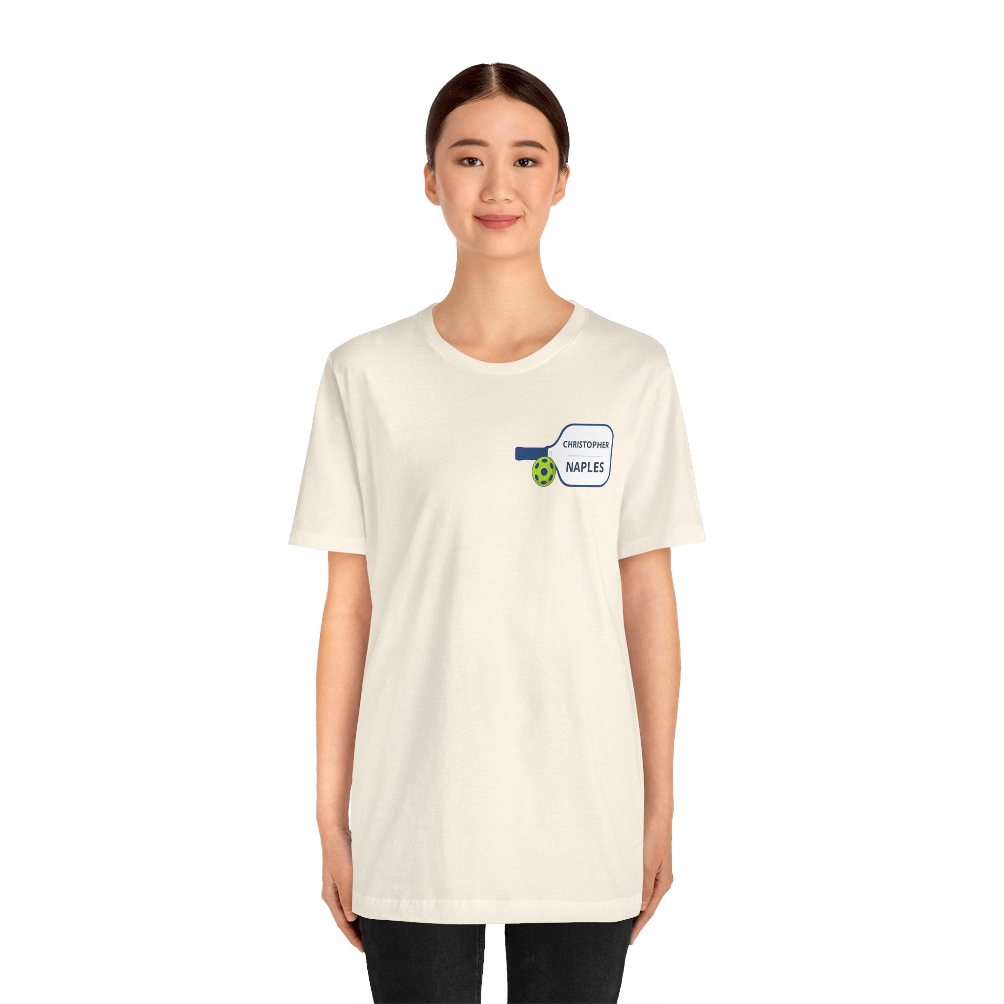 Custom personalized pickleball T-shirt with paddle graphic, featuring your name and club logo, by Printify.
