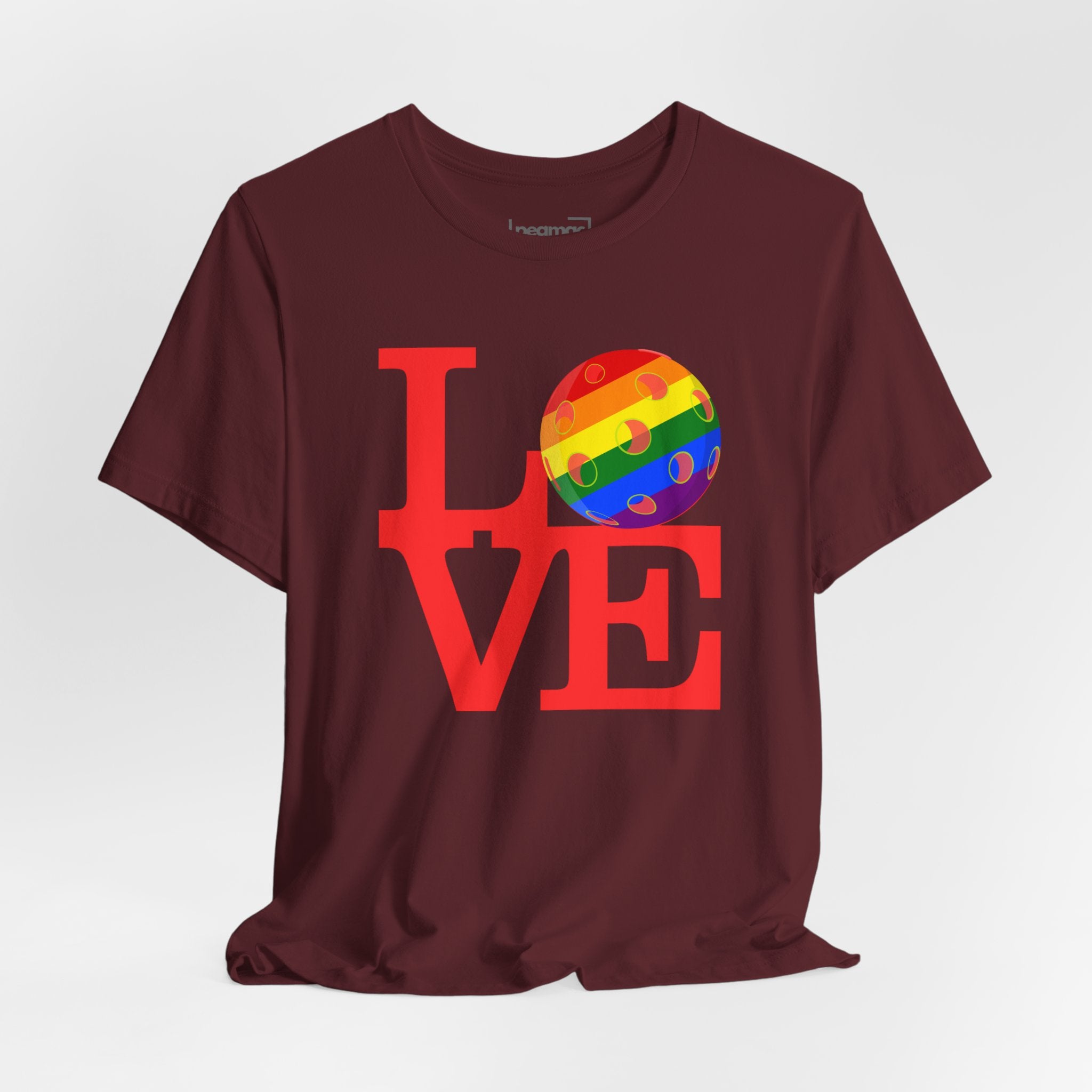 Rainbow LGBTQ2 Pride T-Shirt featuring the LOVE Pickleball logo, colorful design, and casual fit by Printify.