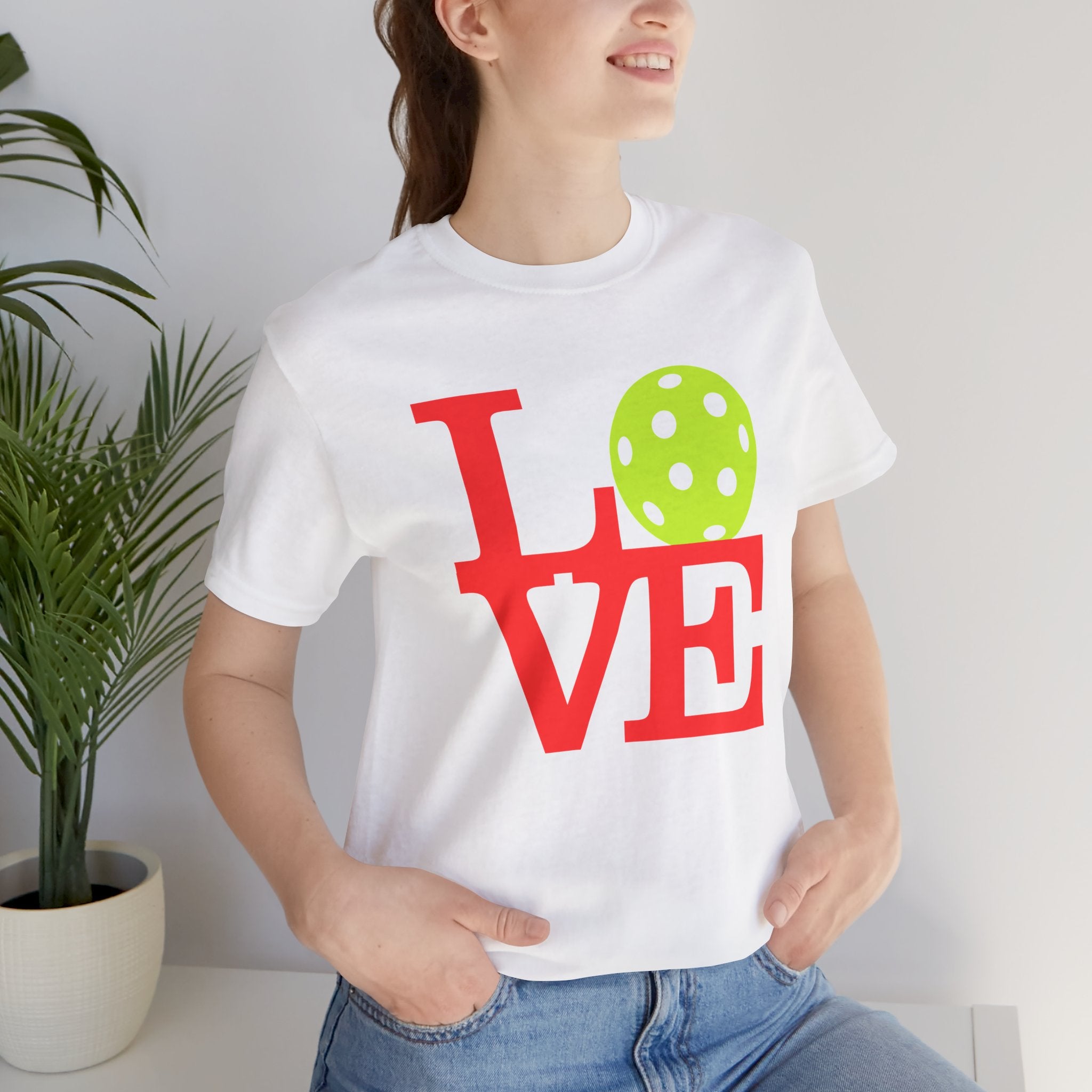 Bright neon pop art LOVE Pickleball T-Shirt by Printify featuring bold colors and a stylish, casual design.