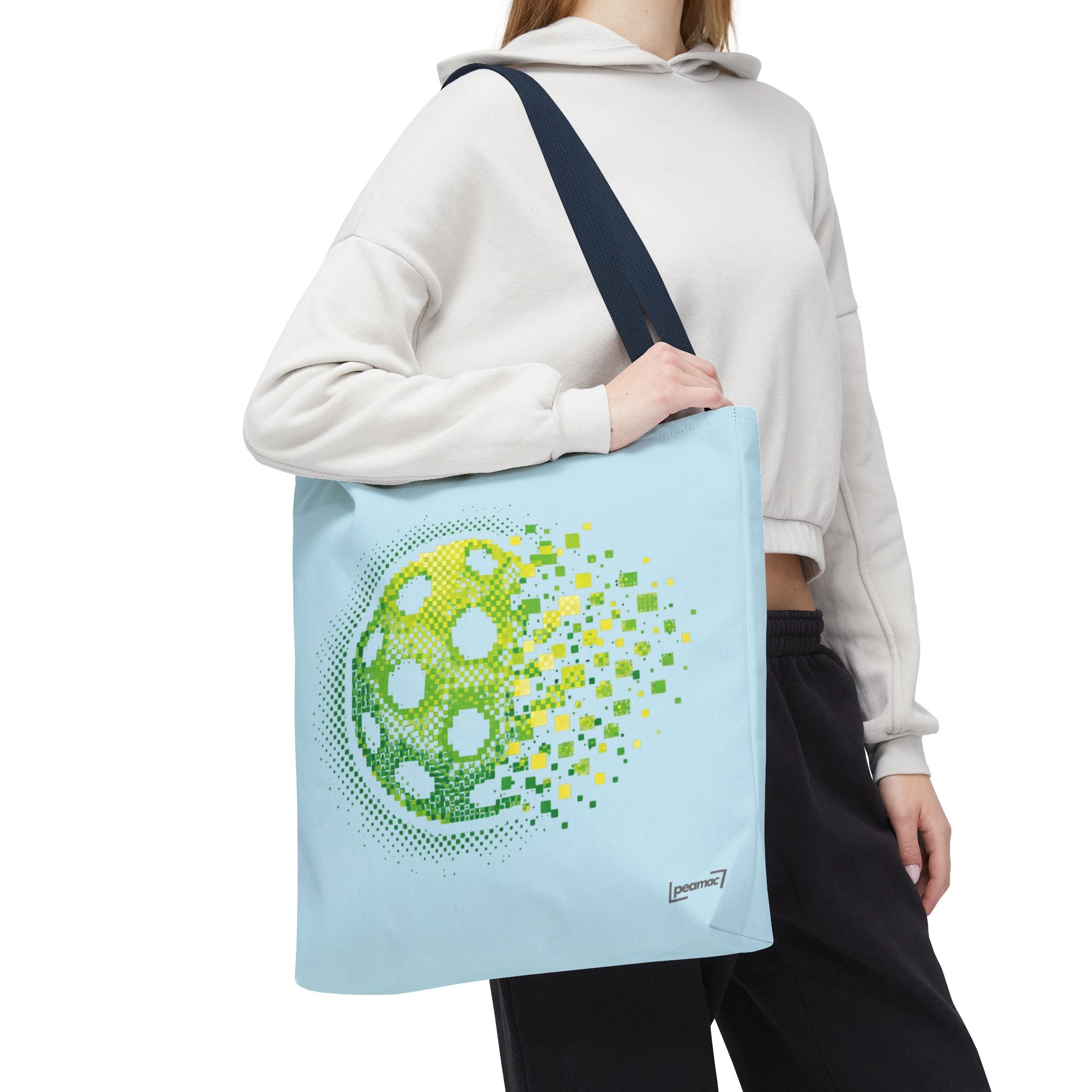 Pixelated pickleball tote bag in green, yellow, and light blue with digital smash design, 18x18 inches, by Printify