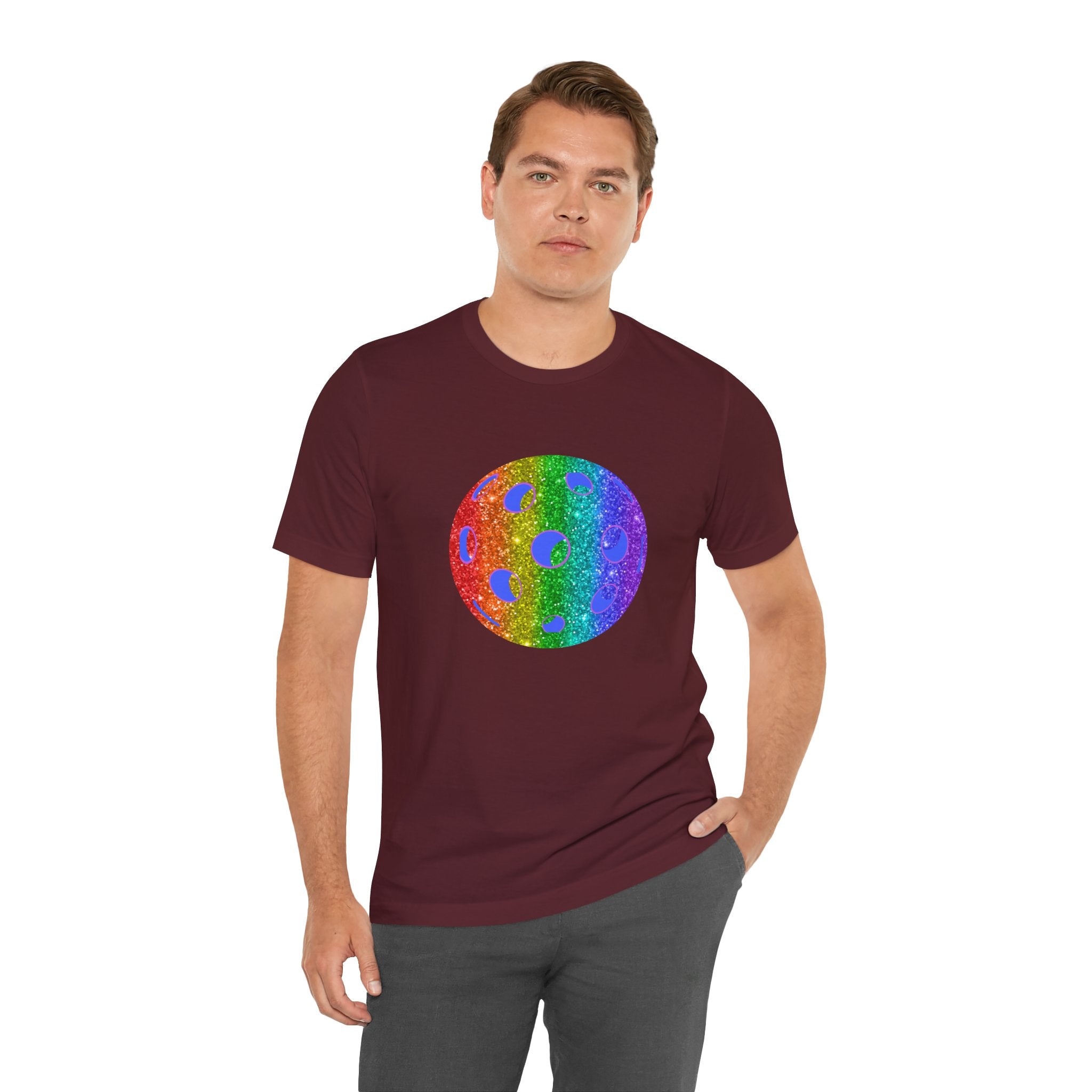Rainbow glitter pickleball pride T-shirt from Printify with bold "Loud and Proud" text and colorful pride-themed design.