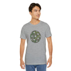 Pickleball Word Cloud T-Shirt featuring a pickleball-shaped graphic with words like Dink, Pickle, and Kitchen on a casual tee.