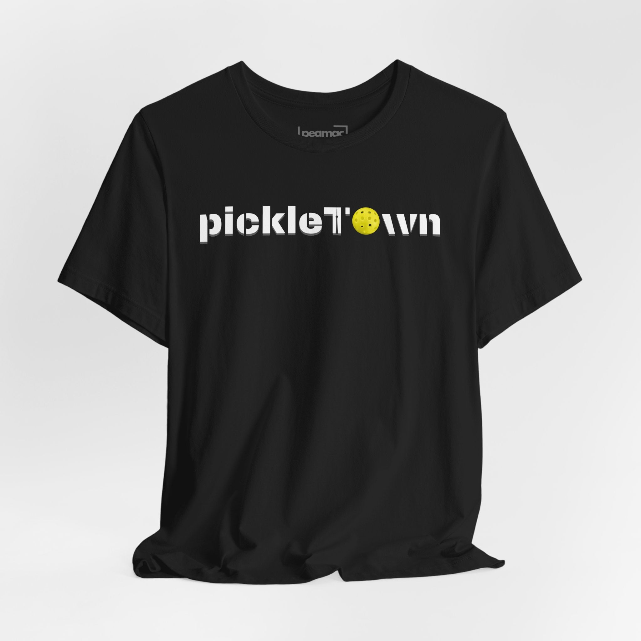 Toronto PickleTOwn T-Shirt featuring CN Tower and pickleball design, casual printify branded tee for fans of Toronto sports and pickleball.