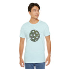 Pickleball Word Cloud T-Shirt showing a pickleball-shaped graphic with words like Dink, Pickle, and Kitchen on a casual tee.