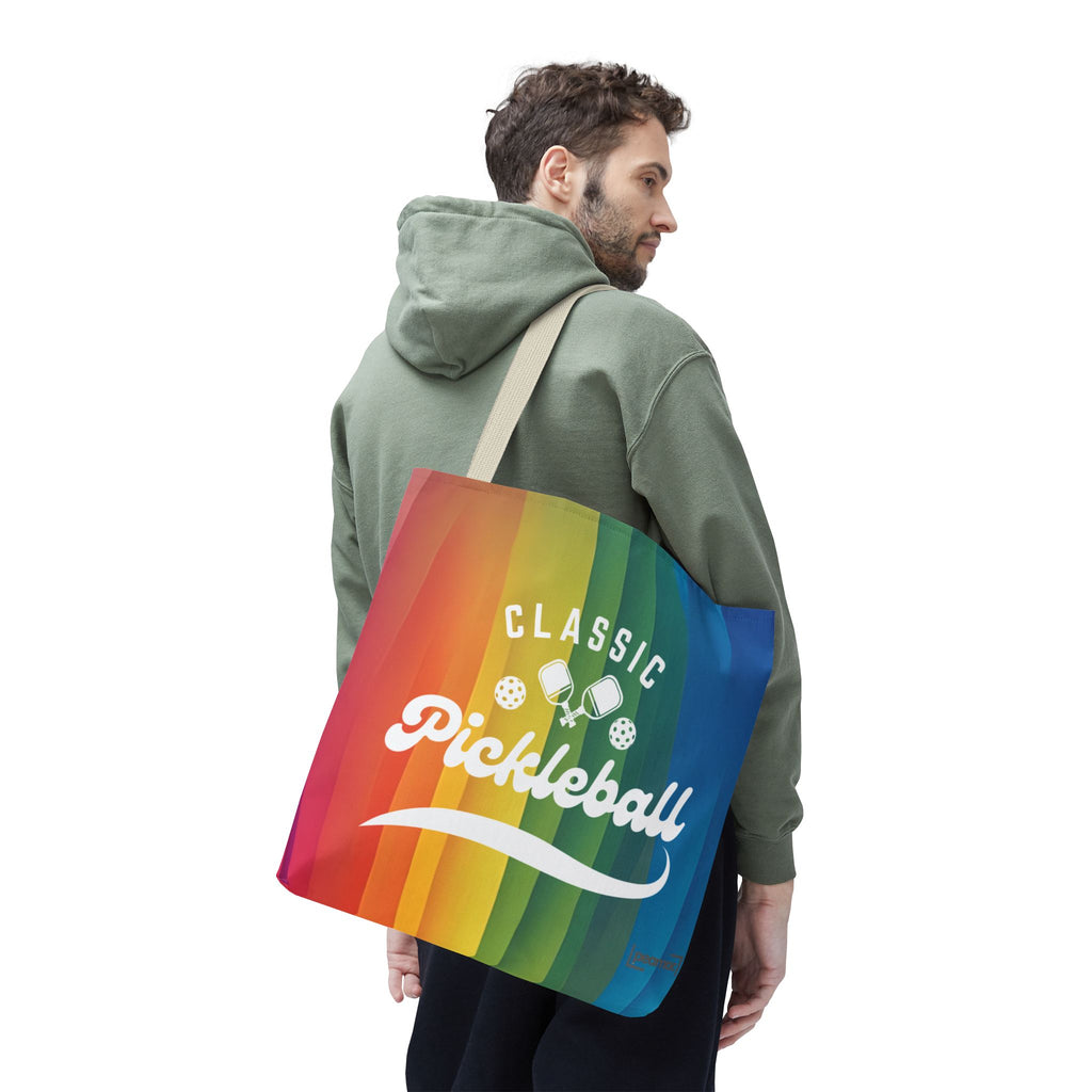 Large rainbow tote bag featuring crossed pickleball paddles and script design, made by Printify for sports and casual use.