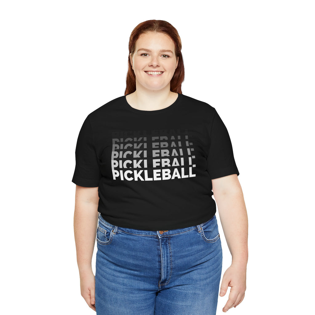 Pink and purple gradient Pickleball x5 Stack Tee with a colorful pickleball graphic on a casual T-shirt.