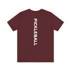 Men's Retro Pickleball Action T-Shirt with front silhouette and vertical "PICKLEBALL" text on the back, by Printify.