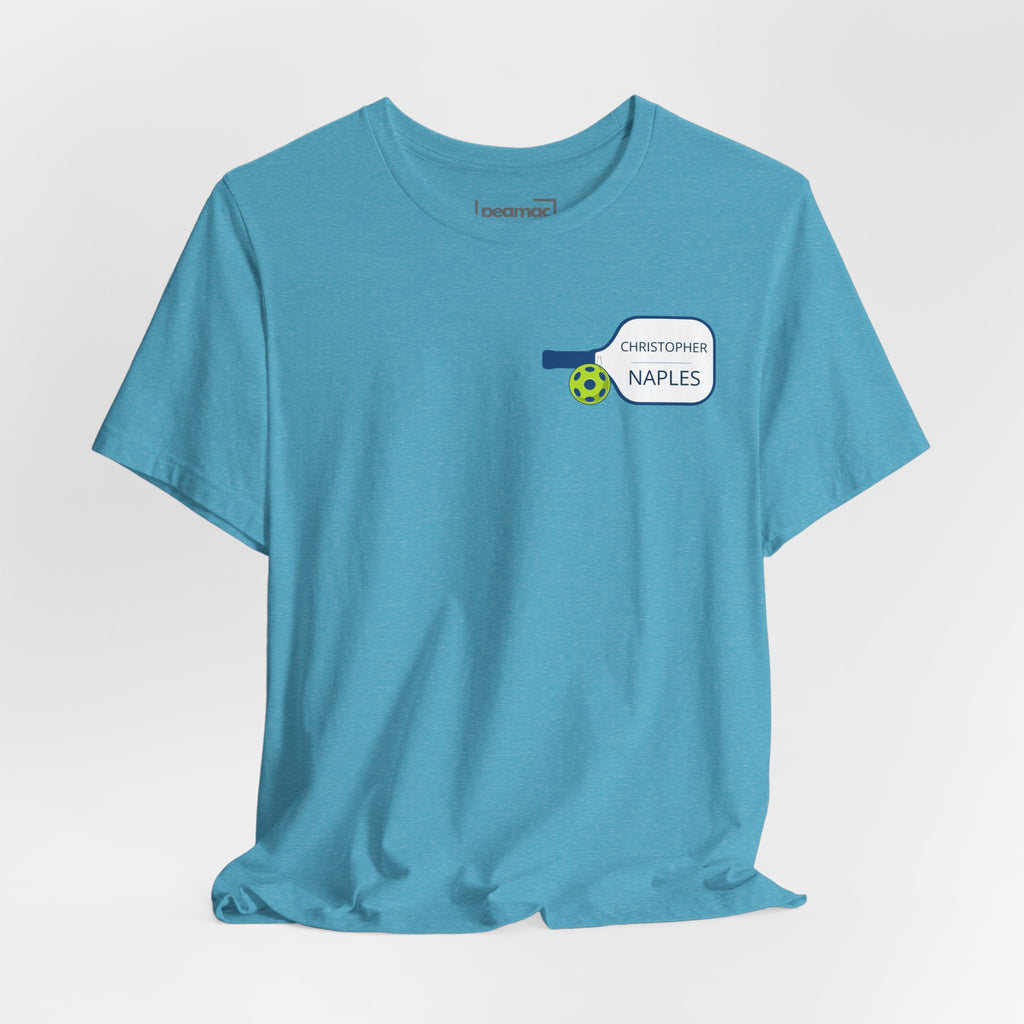 Personalized pickleball T-shirt by Printify with custom name and club text, featuring a paddle graphic design.