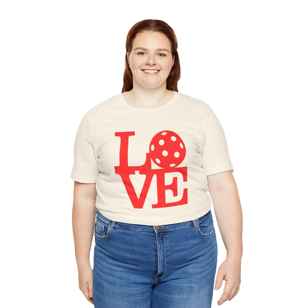 Bright red LOVE Pickleball graphic T-shirt by Printify featuring bold pop art design on a casual cotton tee.