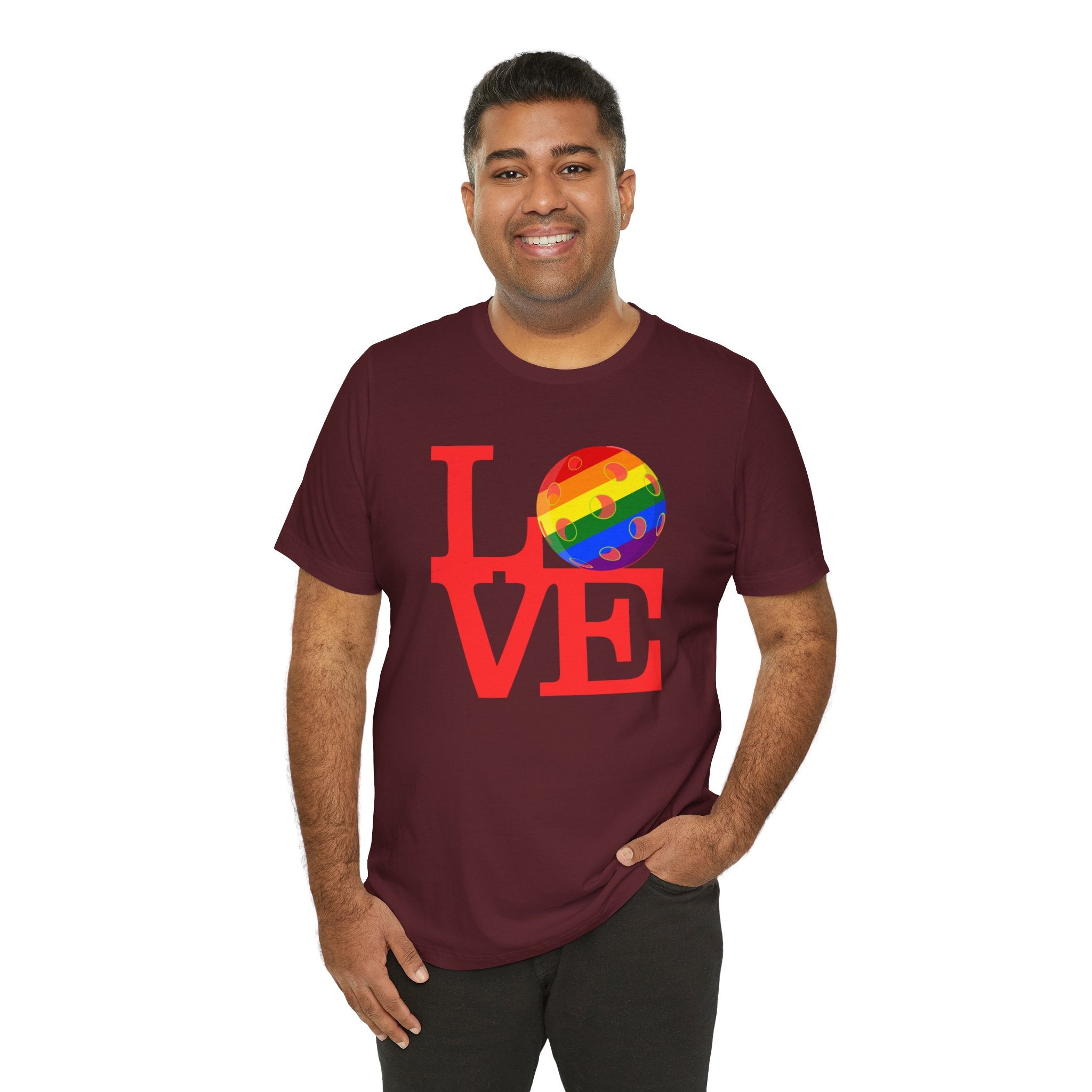 Rainbow LGBTQ2 Pride T-shirt featuring the LOVE Pickleball logo, vibrant rainbow colors, and casual fit from Printify.