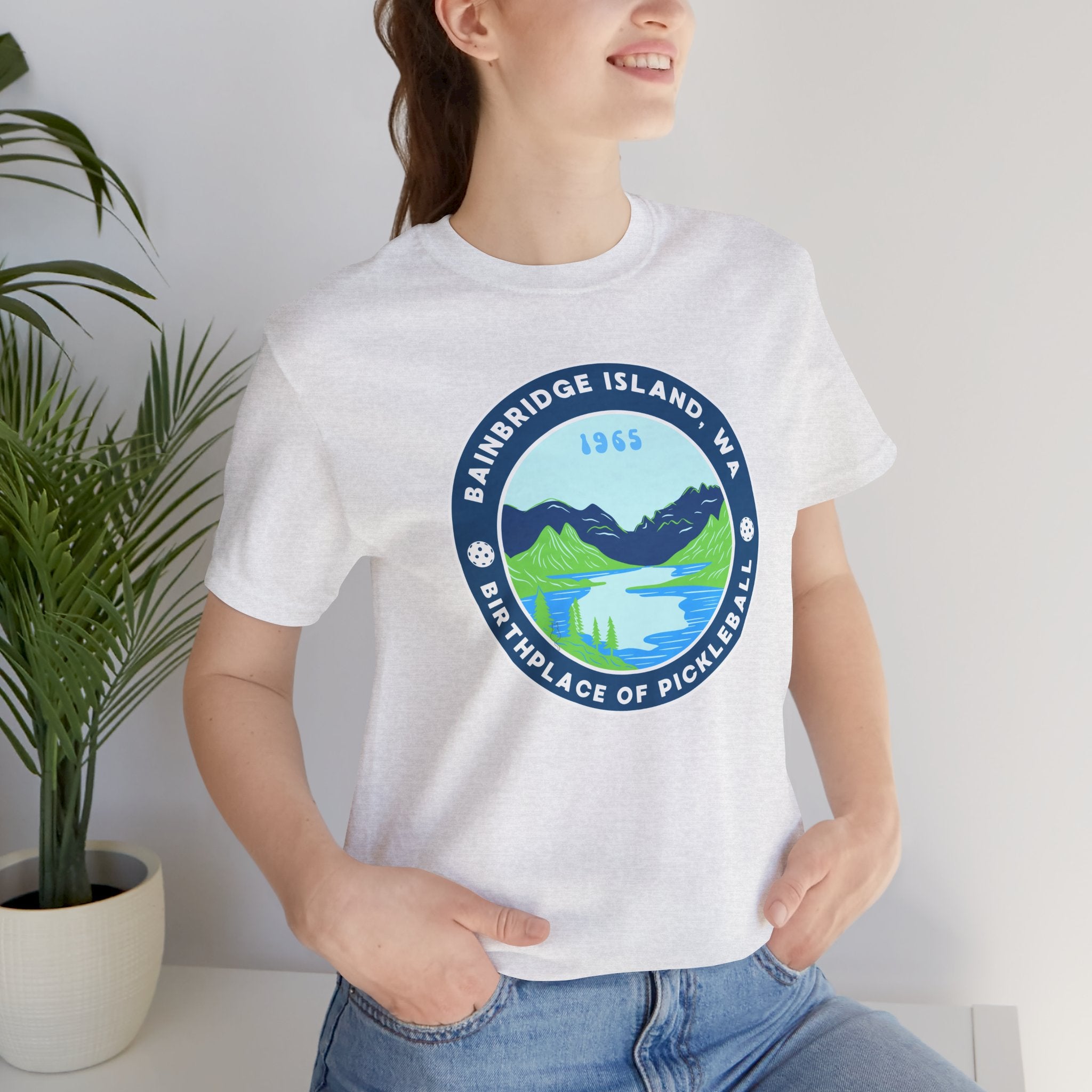 Unisex Bainbridge Island Pickleball Tee featuring "Birthplace of Pickleball 1965" text, casual cotton T-shirt by Printify.