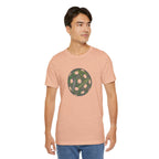Pickleball Word Cloud T-shirt featuring pickleball-shaped graphic with words like dink, pickle, and kitchen on a casual tee.