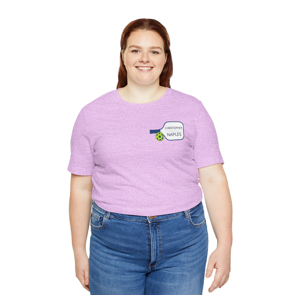 Personalized Pickleball T-shirt with custom name and club logo on the paddle graphic, by Printify.