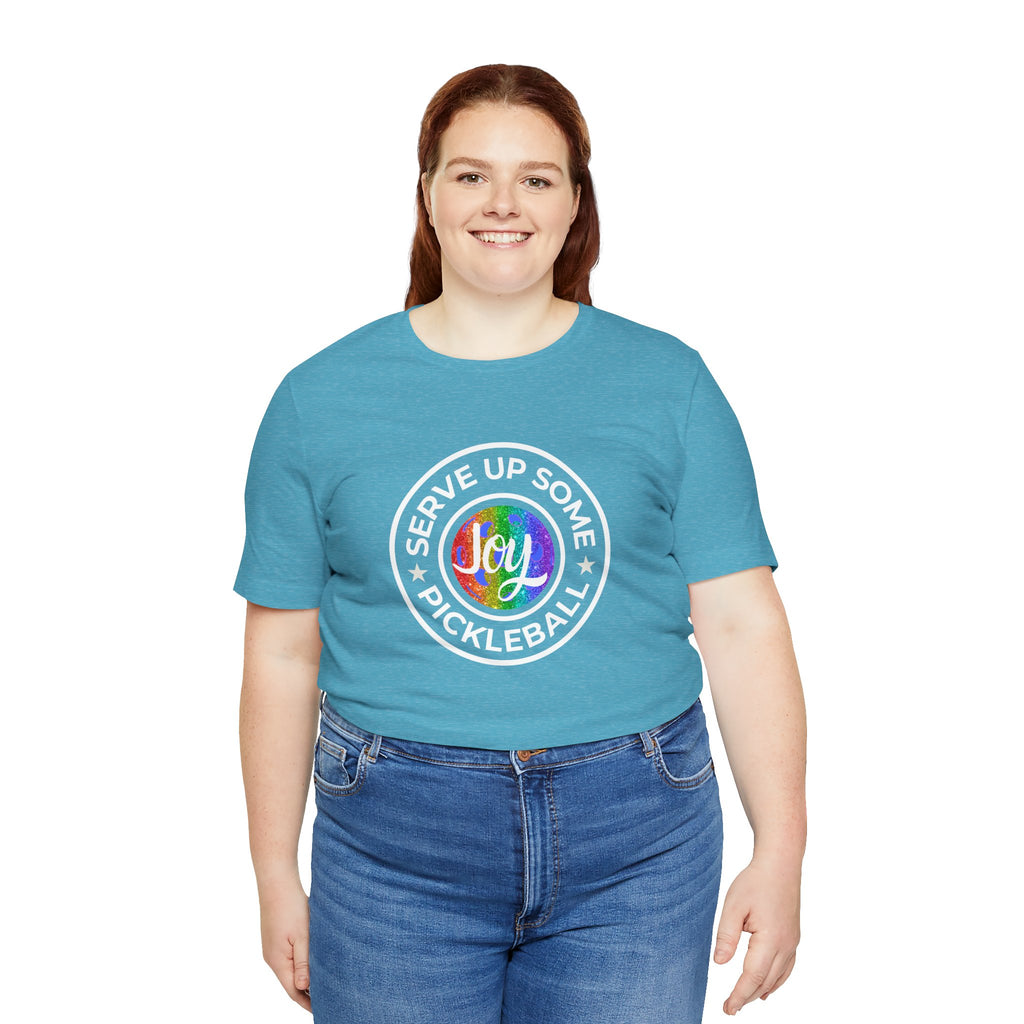 LGBTQ2 pride T-shirt with pickleball joy logo, colorful rainbow design, and "Serve Up Some Pickleball Joy" text on a casual print tee.
