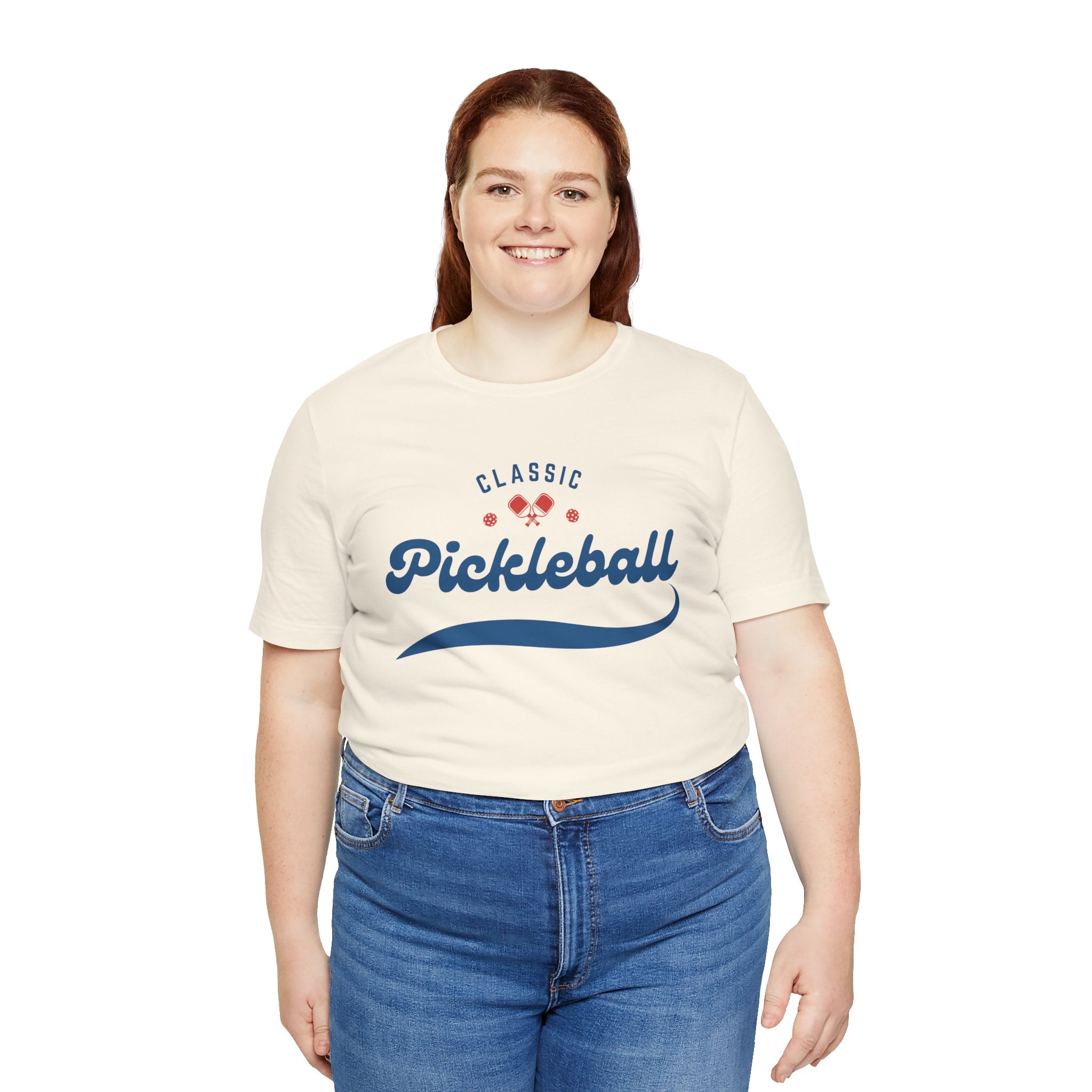 Red and blue pickleball script T-shirt featuring paddle and ball design, casual apparel from Printify.
