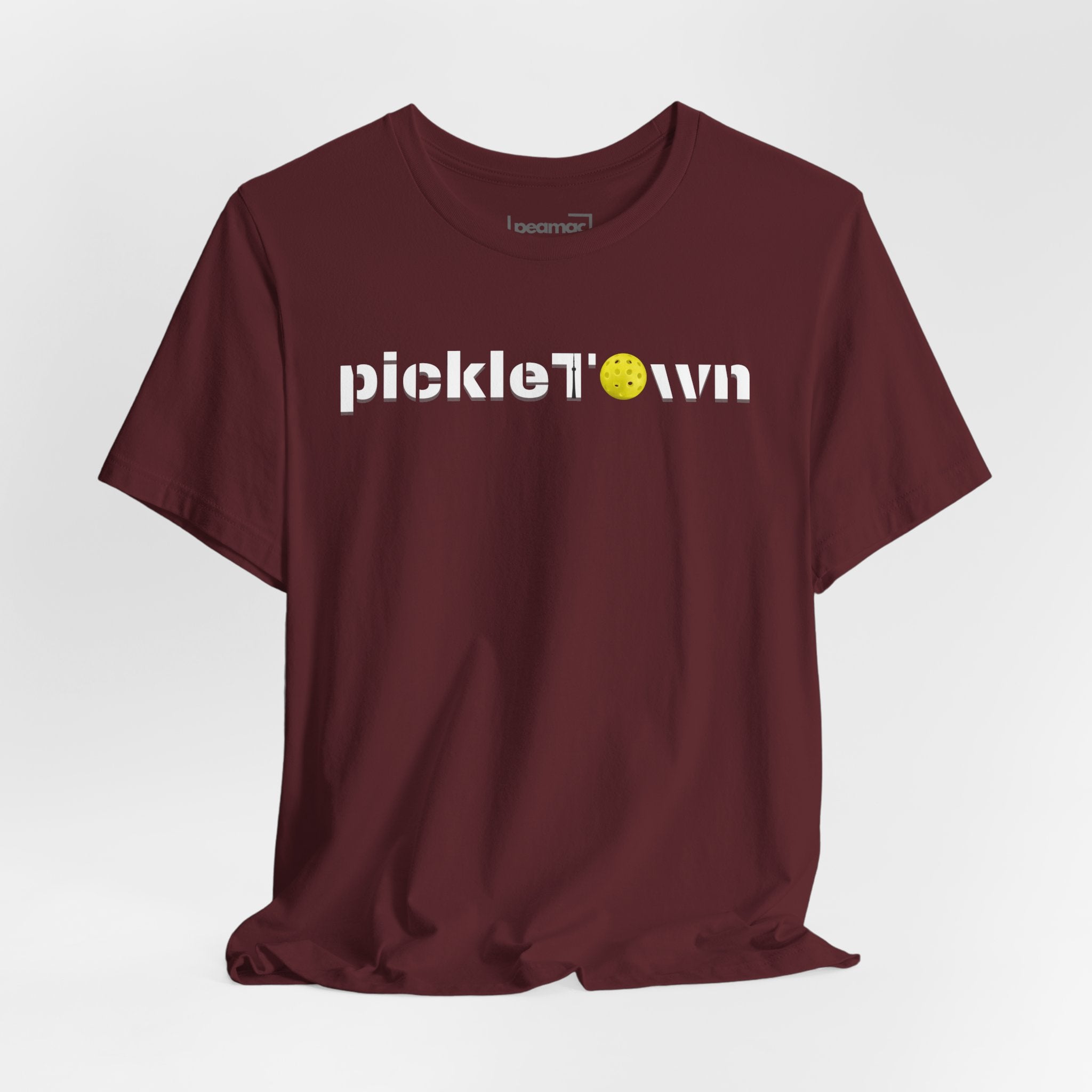 Toronto PickleTOwn T-Shirt featuring CN Tower and Pickleball ‘O’ design, casual graphic tee by Printify.