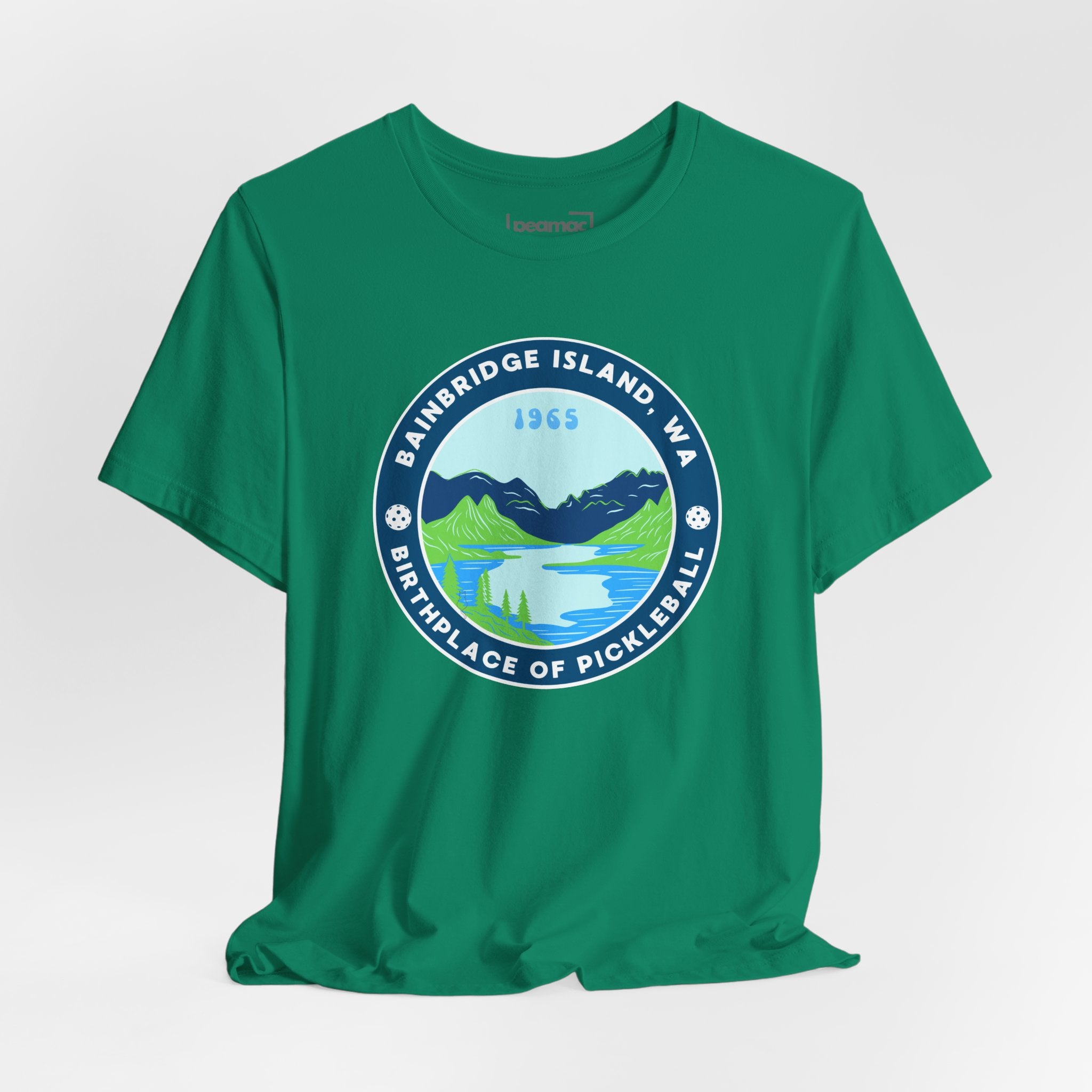 Unisex Bainbridge Island Pickleball T-Shirt featuring "Birthplace of Pickleball 1965" logo on white fabric.