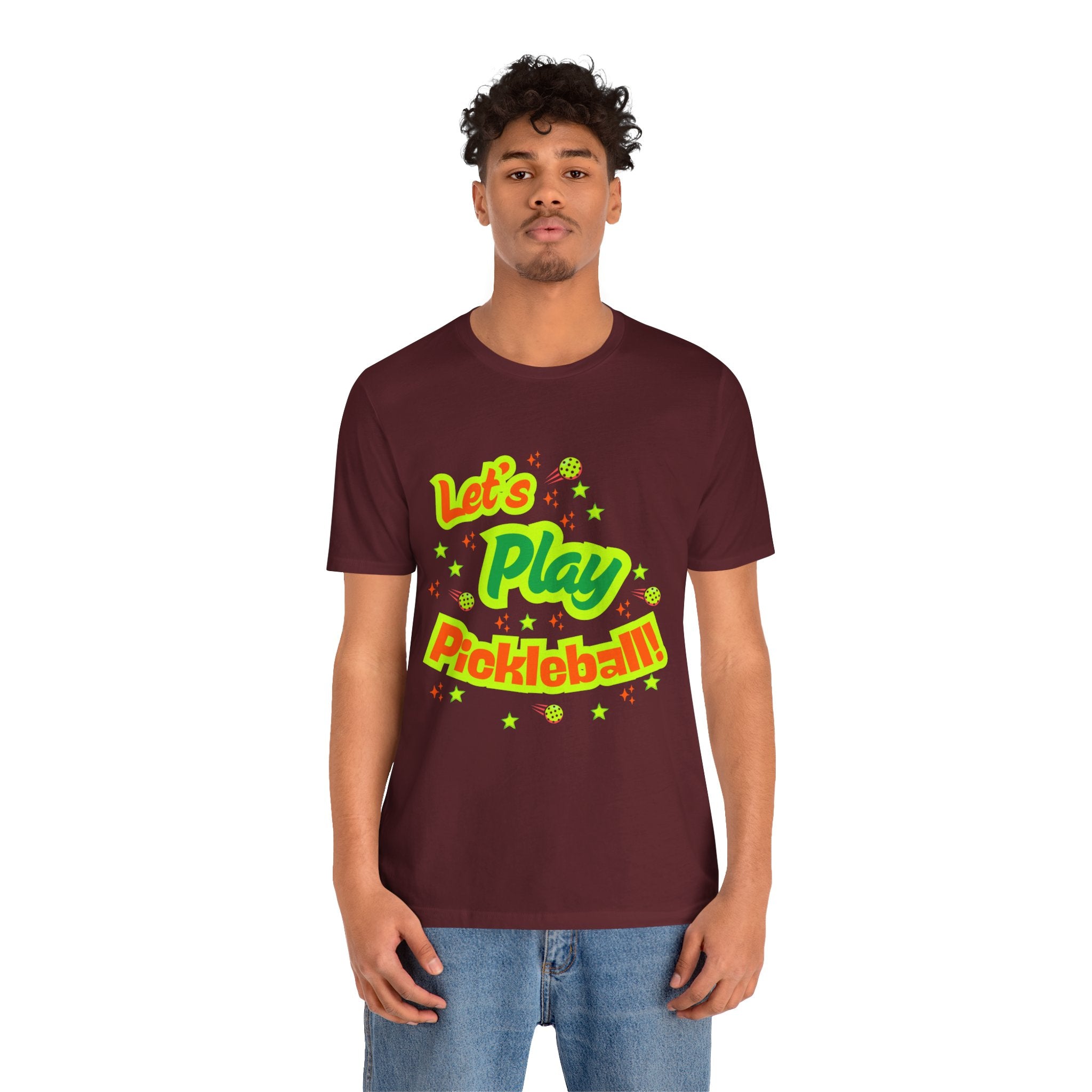 Neon orange and electric green Pickleball Rally T-Shirt with court graphic, casual fit, colorful athletic-inspired design by Printify.