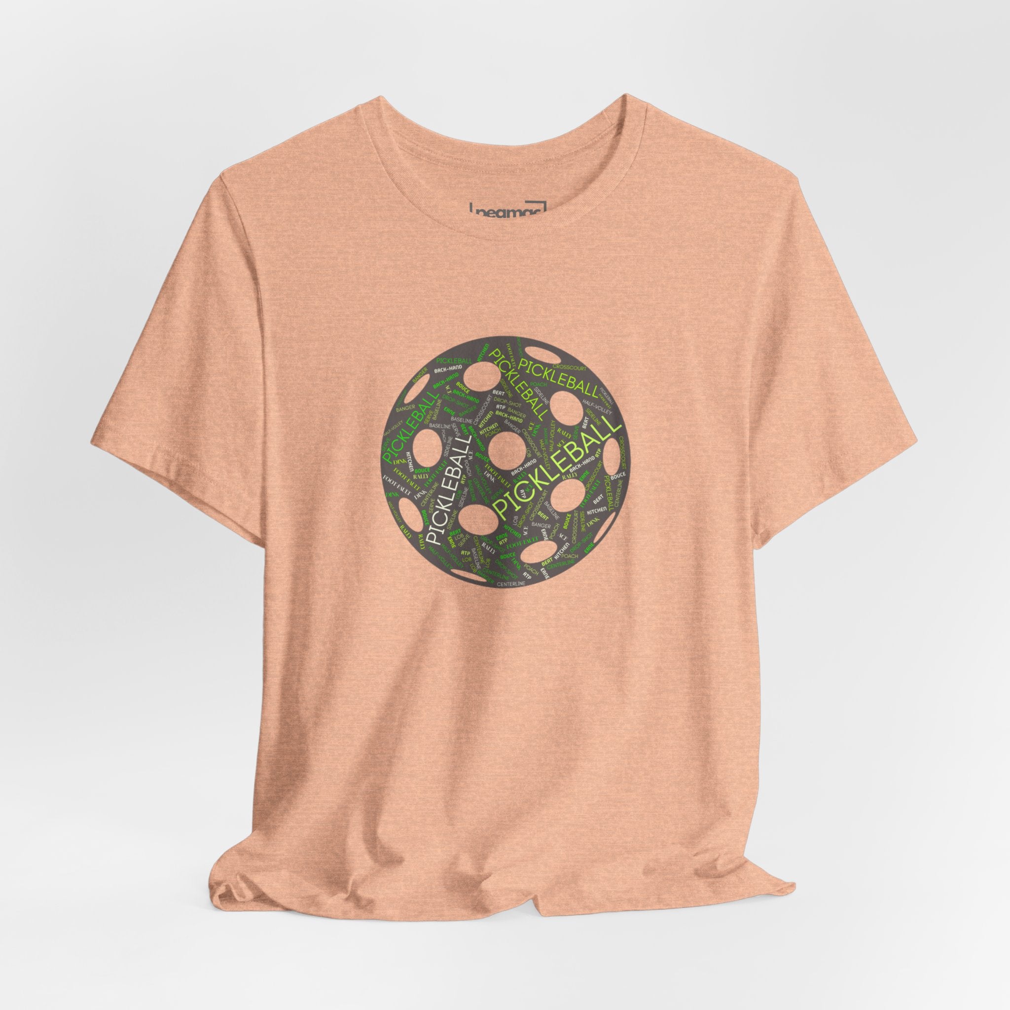 Pickleball Word Cloud T-Shirt with pickleball-shaped graphic and words like dink, pickle, and kitchen printed on a casual tee.