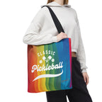 Rainbow tote bag with crossed pickleball paddles and script design, made by Printify, perfect for sports and casual use.
