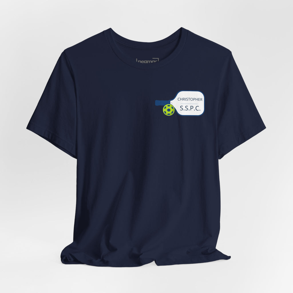 Personalized pickleball T-shirt with custom name and club graphic design, featuring a paddle illustration for sports enthusiasts.