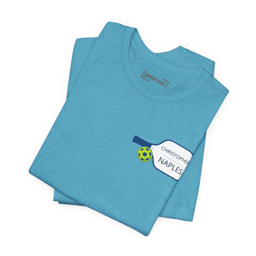 Personalized pickleball T-shirt with custom name and club logo on paddle graphic design, ideal for pickleball enthusiasts.