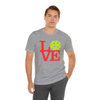 Neon pop art LOVE pickleball T-shirt by Printify featuring bright colors and bold design on a premium cotton T-shirt.