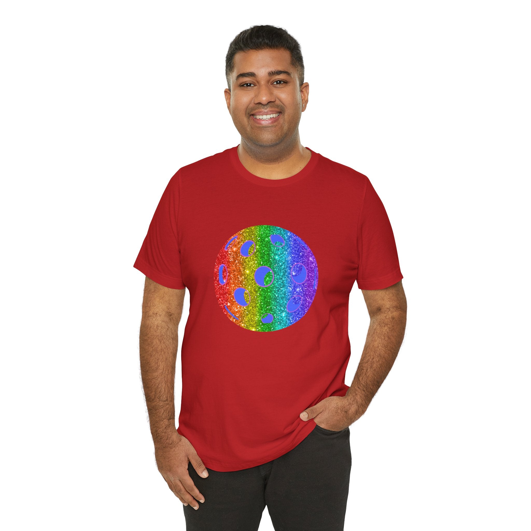 Rainbow glitter pickleball pride T-shirt featuring bold "Loud and Proud" text, celebrating LGBTQ+ pride with vibrant colors.
