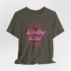 Pink Dinking Diva pickleball T-shirt with filigree design, athletic fit, and printed logo, ideal for active pickleball players.