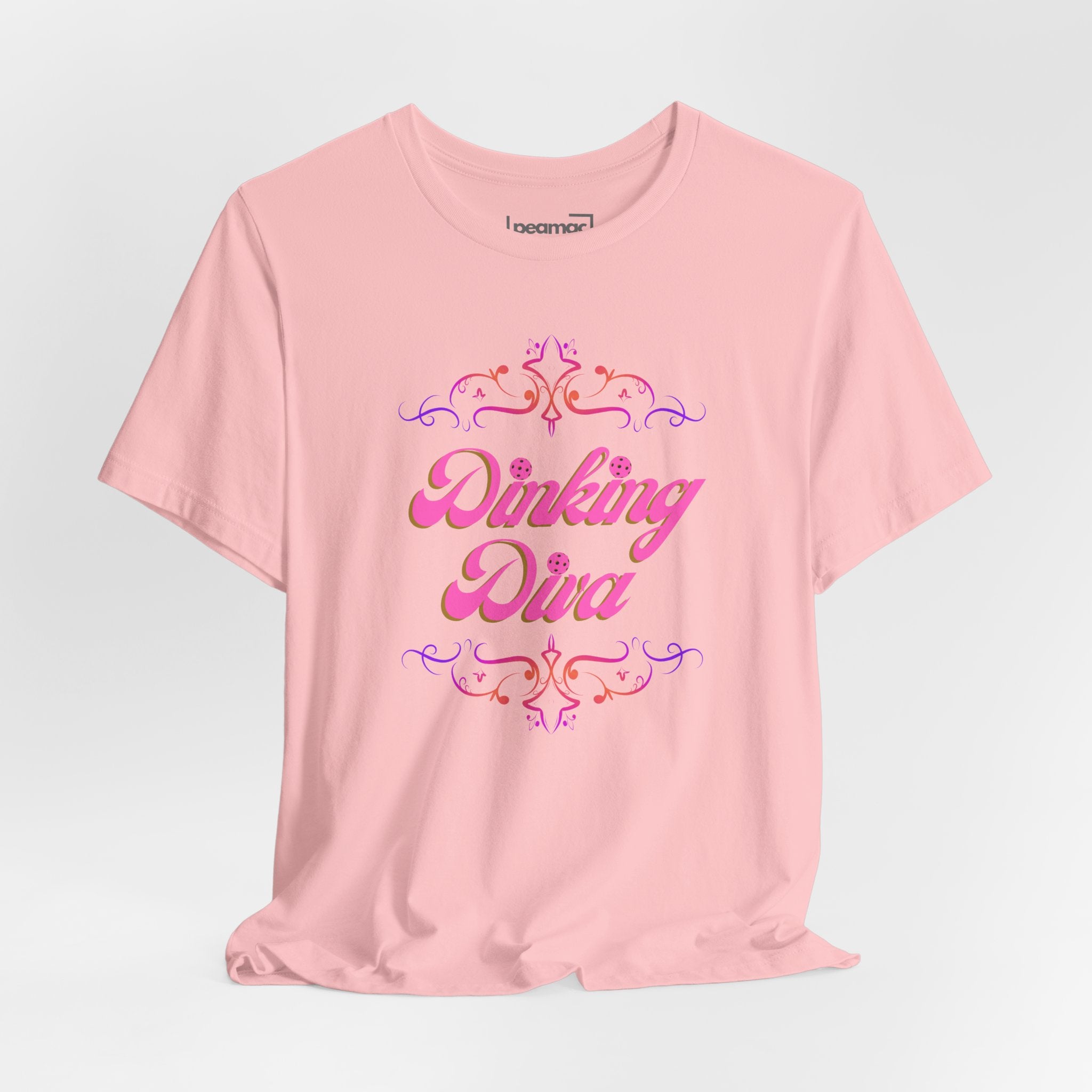 Pink Dinking Diva pickleball T-shirt with filigree design, athletic fit, and printed logo on the front.