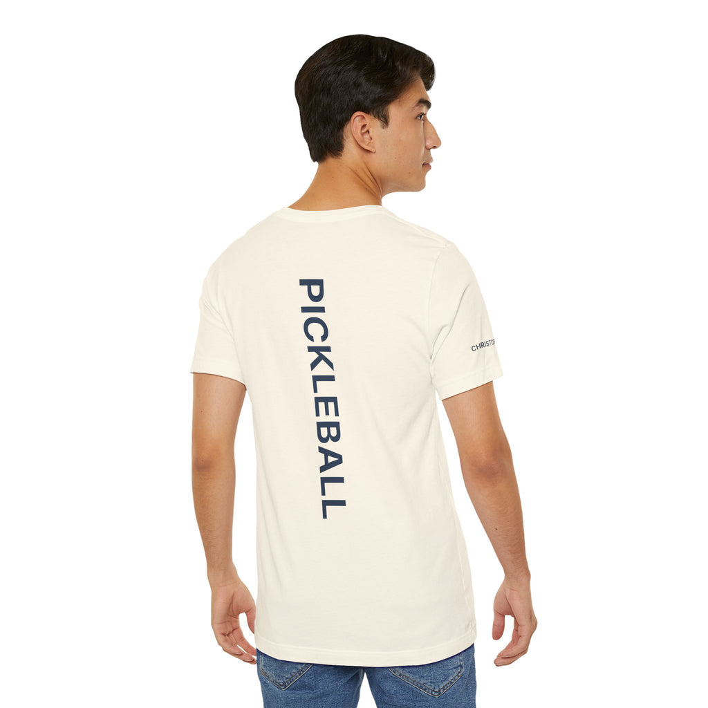 Personalized pickleball T-shirt by Printify with custom name sleeve and club logo on back, featuring pickleball graphic on center.
