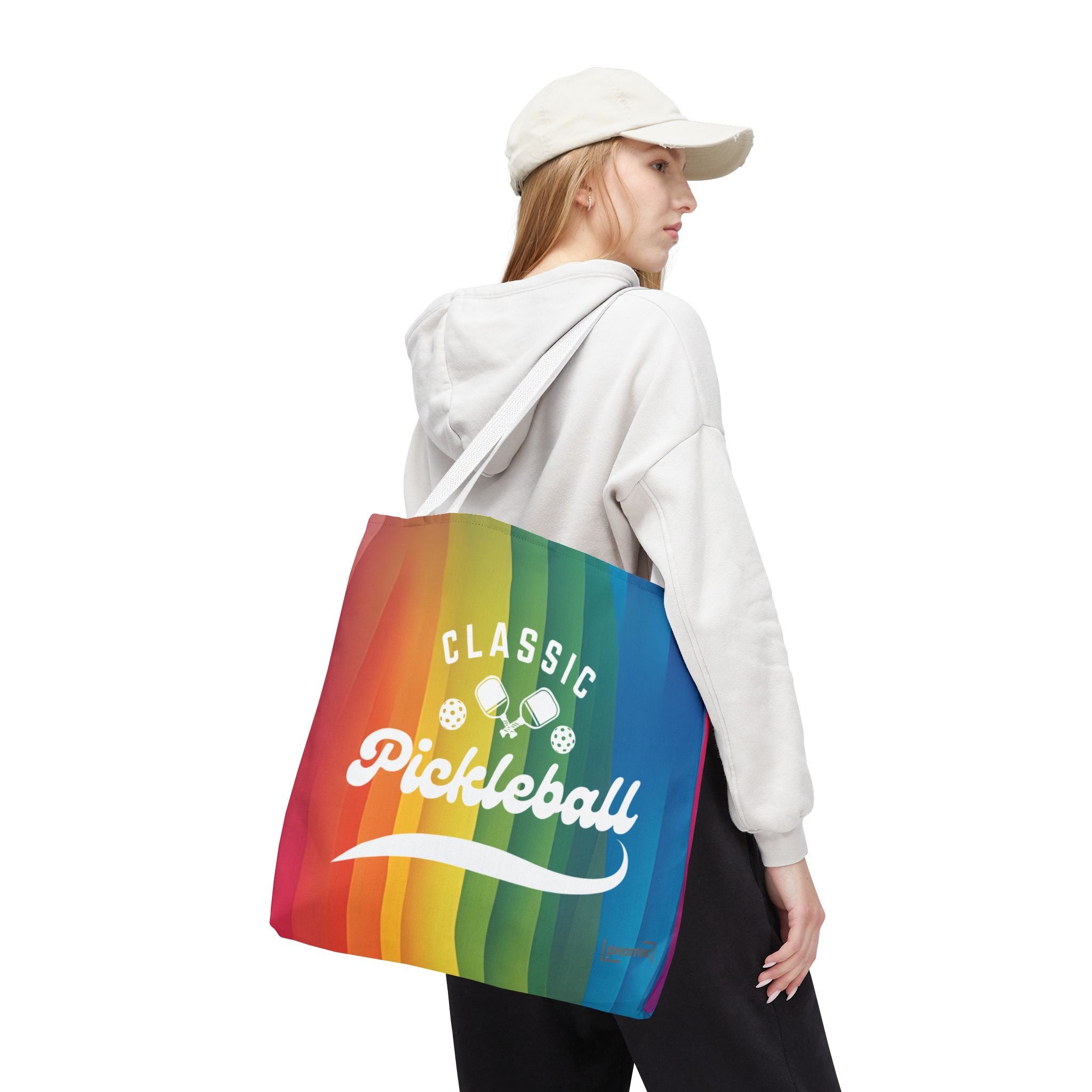 Colorful pickleball tote bag with crossed paddles and script design, featuring a vibrant rainbow pattern by Printify.
