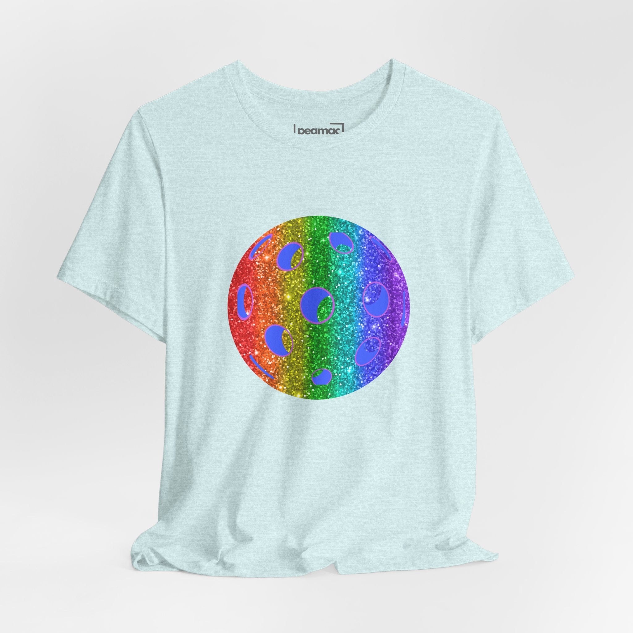 Rainbow glitter pickleball T-shirt with "Loud and Proud" slogan, celebrating pride and inclusivity, made by Printify.