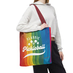 Colorful pickleball tote bag with crossed paddles and script design, featuring rainbow accents, by Printify.