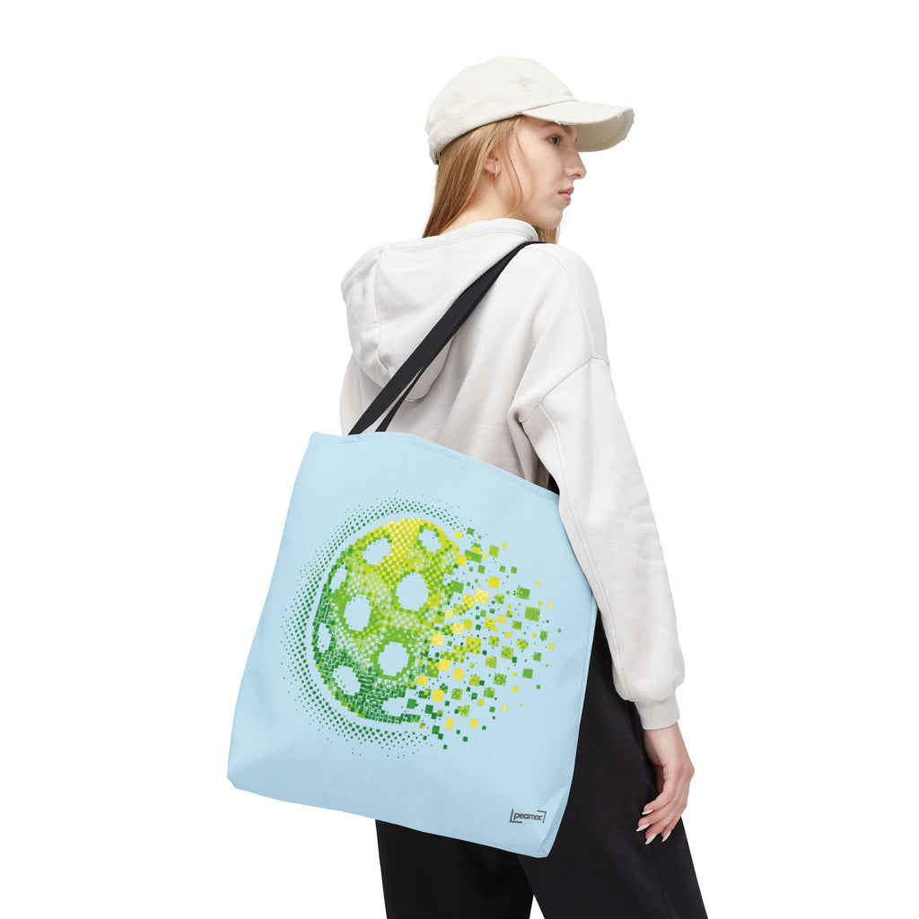 Pixelated pickleball tote bag in green, yellow, and light blue with digital smash design, 18x18 inches, by Printify.