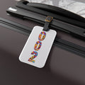 Pickleball court ID luggage tag with leather strap and buckle, featuring pastel psychedelic numbers for easy identification.