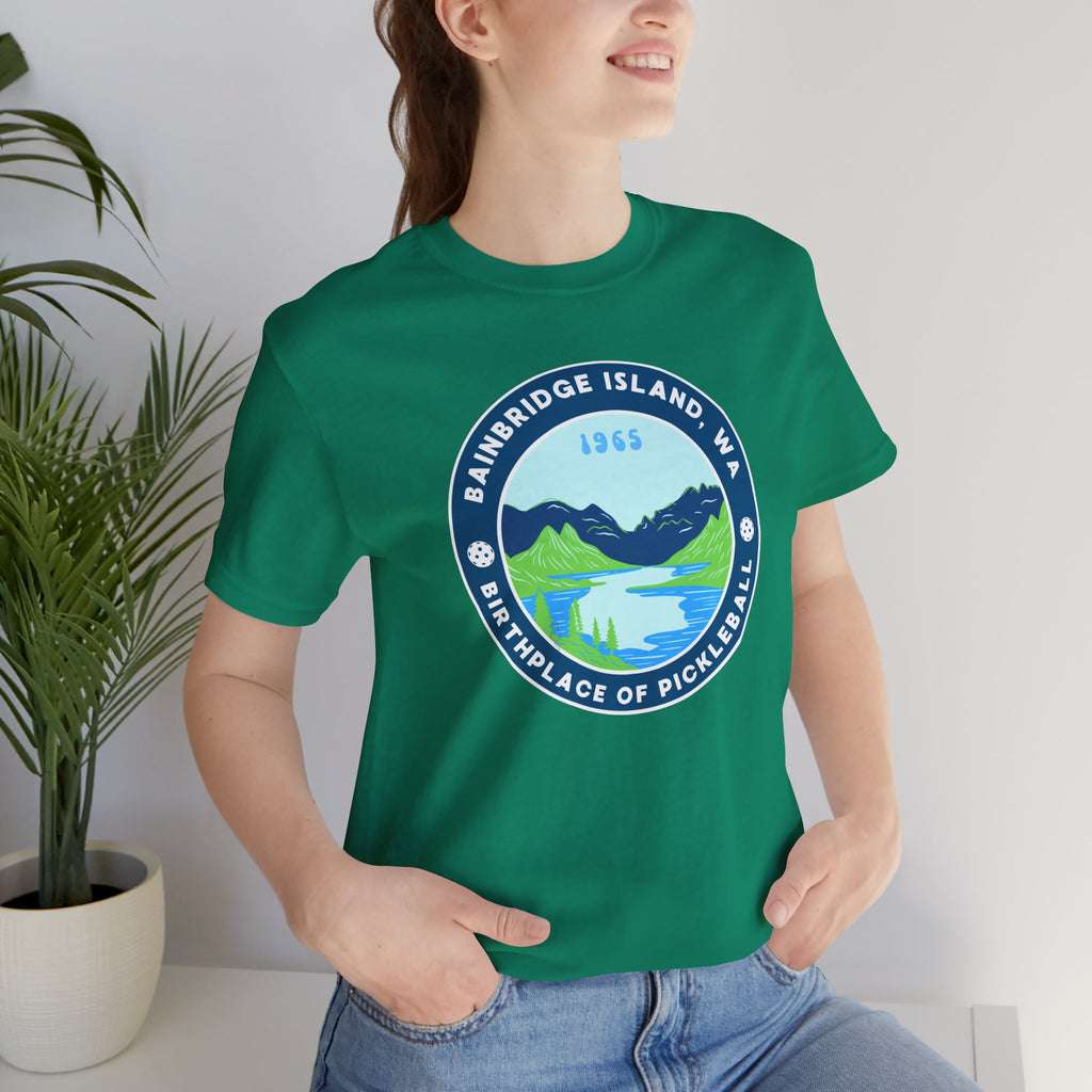 Unisex Bainbridge Island Pickleball Tee featuring "Birthplace of Pickleball 1965" text and a casual fit, by Printify.