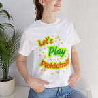 Neon orange and electric green pickleball rally graphic T-shirt by Printify, featuring vibrant court design and casual fit.