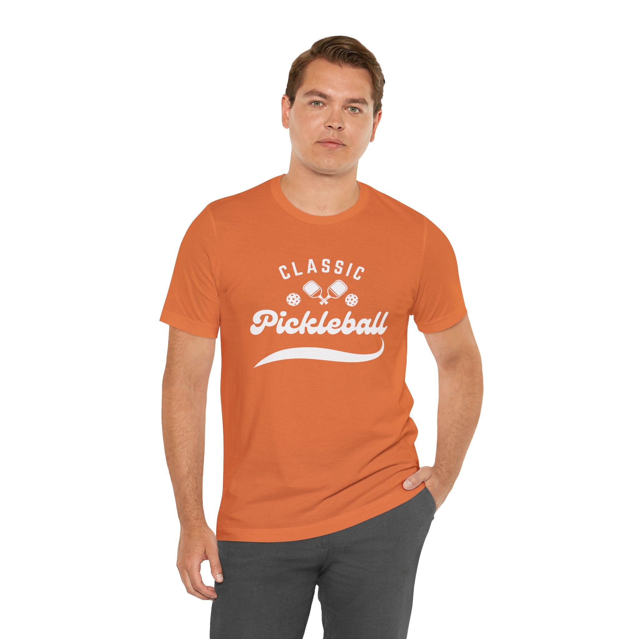 Classic pickleball T-shirt with "Pickleball" script design, casual athletic wear by Printify, shown on a model.