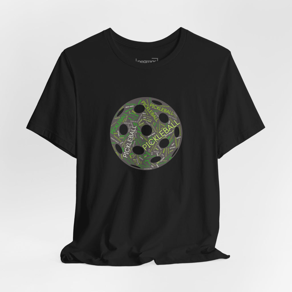 Pickleball Word Cloud T-Shirt with pickleball-shaped graphic featuring words like dink, pickle, and kitchen on a casual tee.