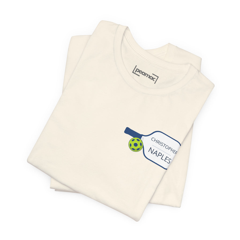 Personalized pickleball T-shirt with custom name and club design on the paddle graphic, made by Printify.