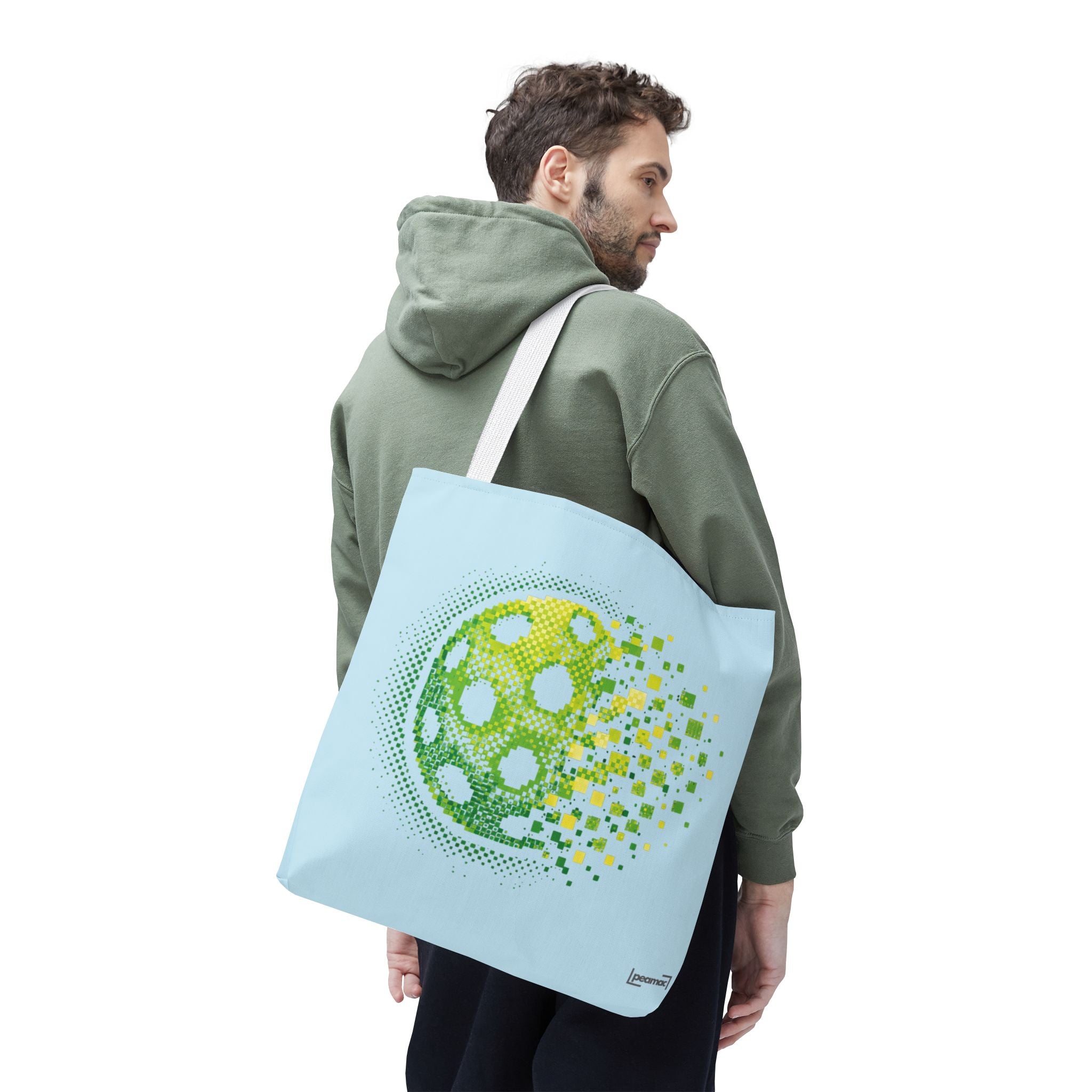 Pixelated pickleball tote bag in green, yellow, and light blue with digital smash design, 18x18 inches, by Printify.