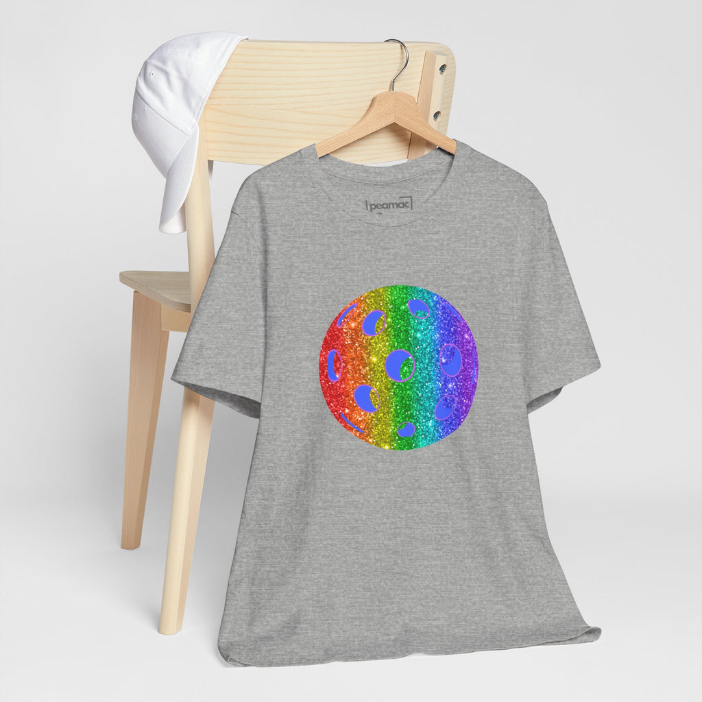 Rainbow glitter pickleball T-shirt featuring the Sparkle Loud and Proud Pickleball Pride Tee design by Printify on a colorful Pride-themed shirt.