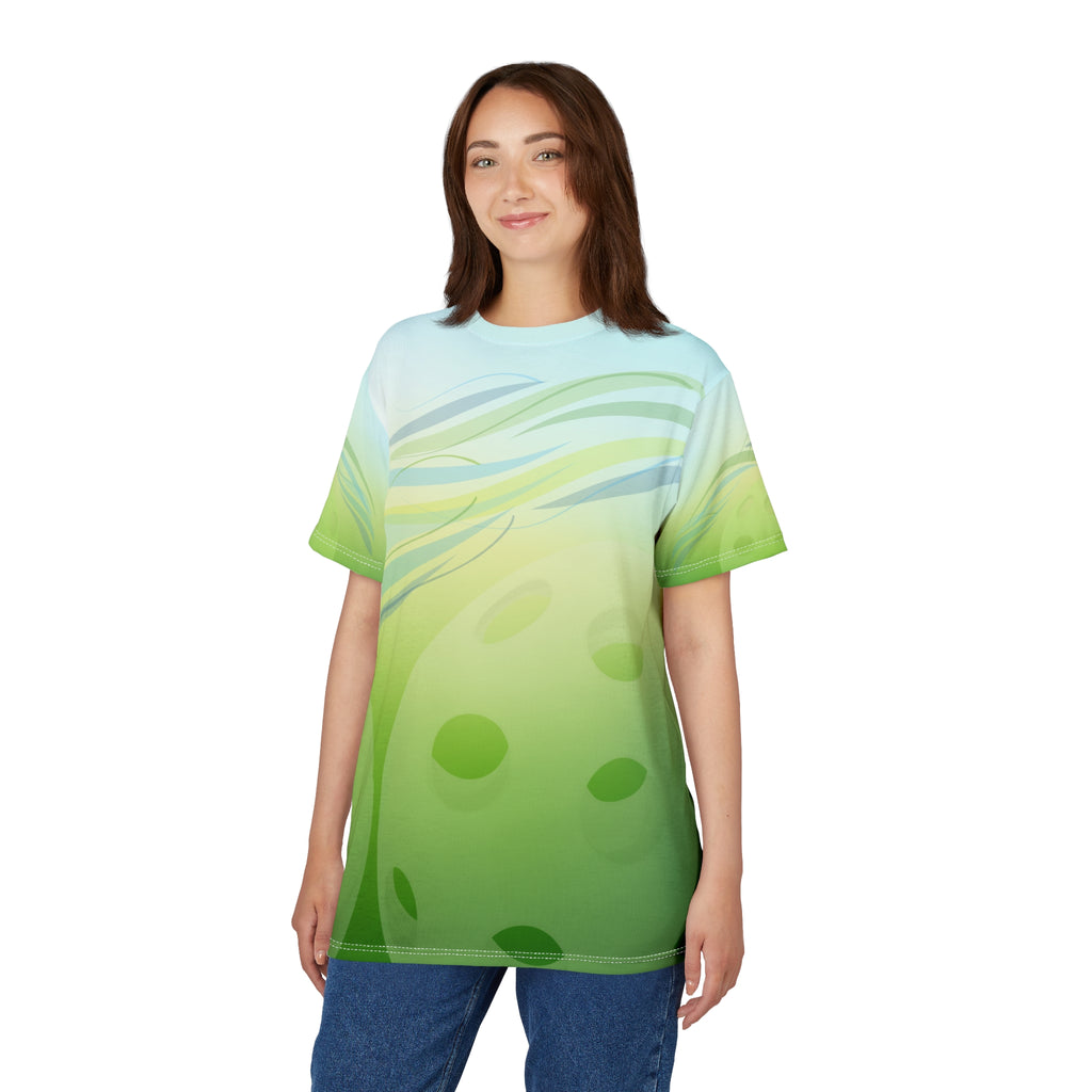 Unisex Pickleball Summer Breeze Tee with green leaf wave all-over print, featuring vibrant tropical-inspired design.