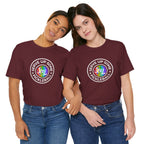 LGBTQ2 pride pickleball T-shirt featuring colorful rainbow design and "Serve Up Some Pickleball Joy" text on a casual cotton tee.