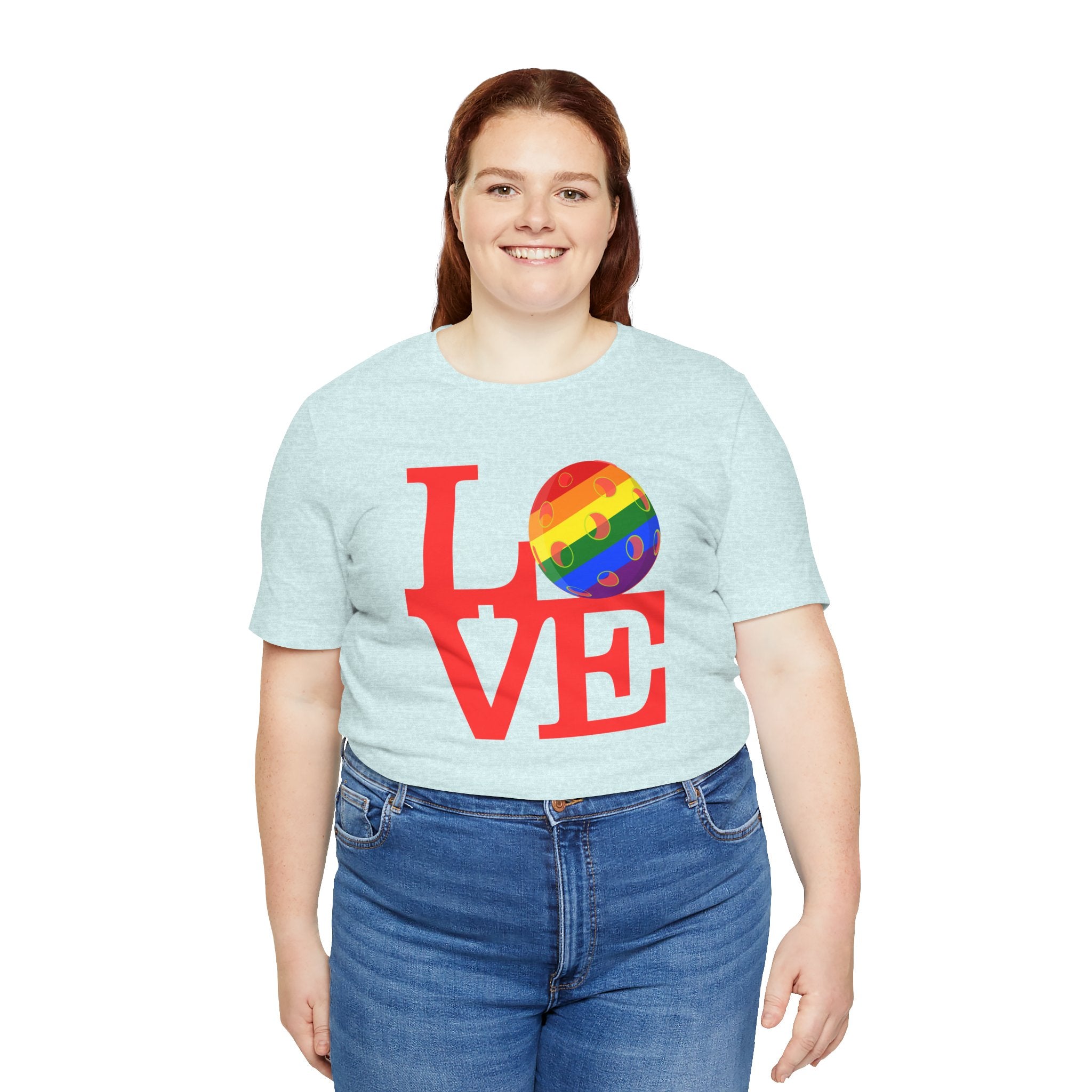 Rainbow LGBTQ2 Pride T-Shirt featuring LOVE Pickleball print, vibrant colors, and comfortable fit from Printify on a casual tee.