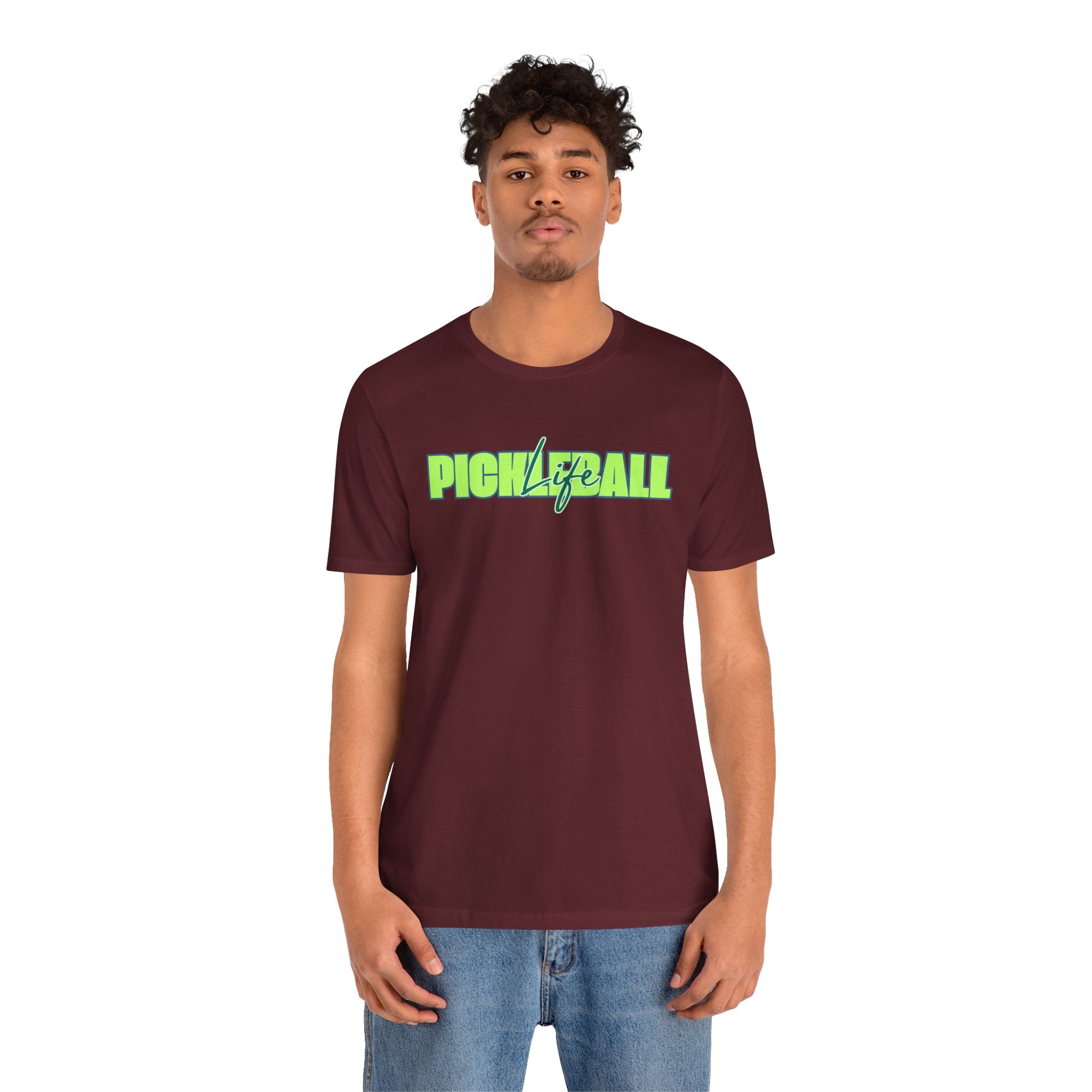 Unisex Pickleball Life T-shirt with bold green and blue graphic print, featuring a comfortable fit and casual style.